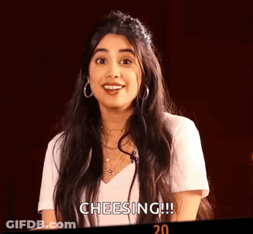 Woman With Long Hair White Shirt And Earrings Smiling GIF