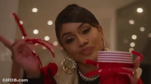 Woman With Long Nails Holding Red Cup Peace Sign GIF