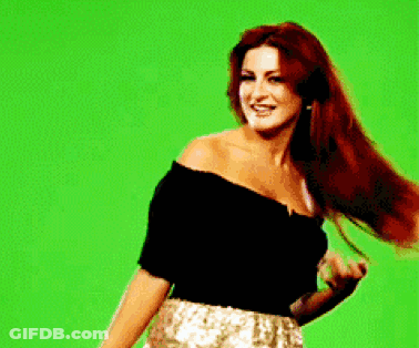Woman With Long Red Hair And Green Background GIF
