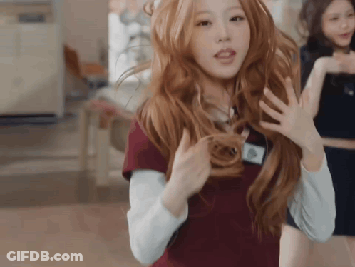 Woman With Long Red Hair And Name Tag A GIF