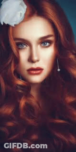 Woman With Long Red Hair And White Flower GIF