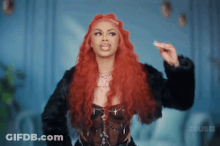 Woman With Long Red Hair In Black Jacket GIF