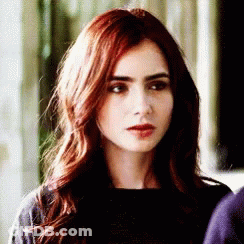 Woman With Long Red Hair In Black Top GIF