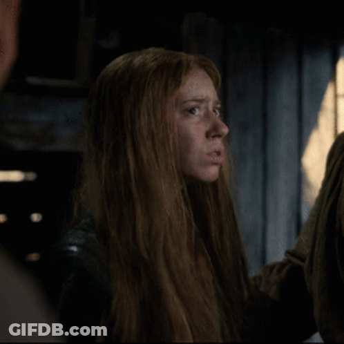 Woman With Long Red Hair In Dark Room GIF