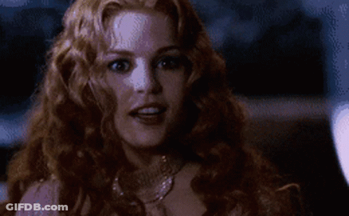 Woman With Long Red Hair In Pink Dress And Necklace GIF