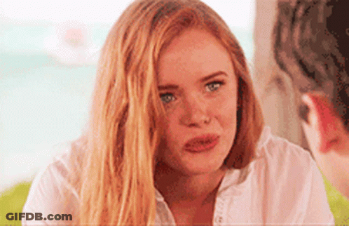 Woman With Long Red Hair Looking At Man GIF