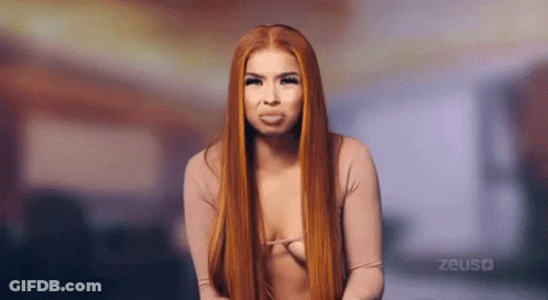 Woman With Long Red Hair Making Funny Face GIF