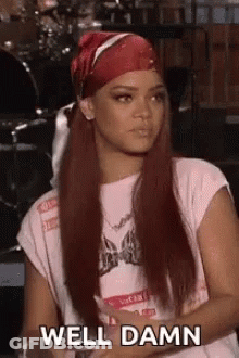 Woman With Long Red Hair Wearing Bandana And T-Shirt GIF