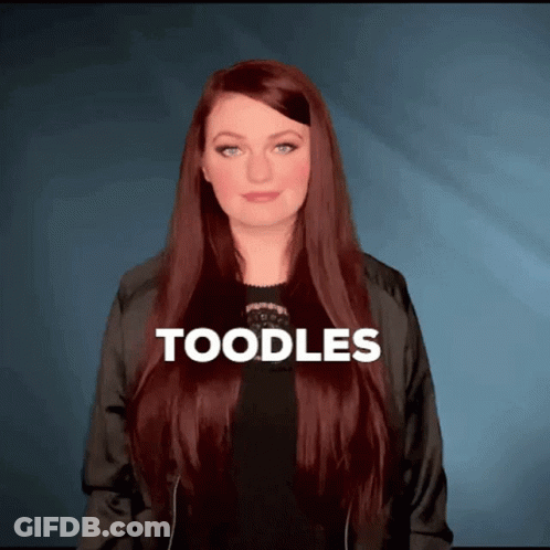 Woman With Long Red Hair Wearing Black Jacket Saying Toodles GIF