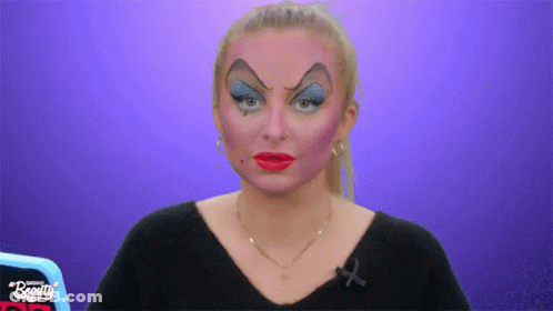 Woman With Makeup And Black Shirt Saying Beauty GIF