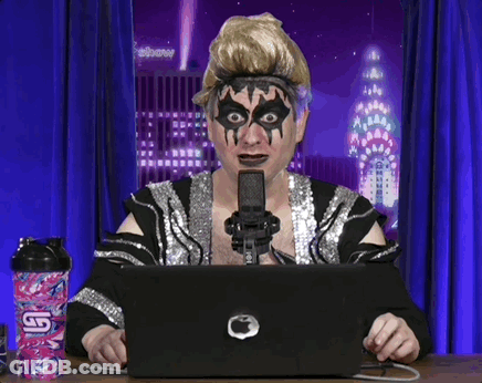 Woman With Makeup Sitting At Laptop With Pink Bottle Saying G GIF