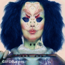 Woman With Mask Holding Flute GIF