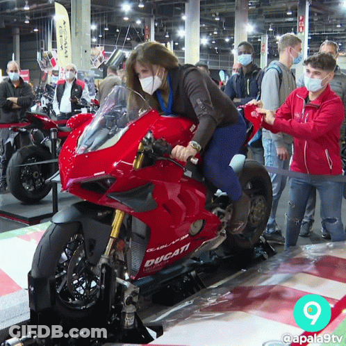 Woman With Mask On Ducati Motorcycle GIF