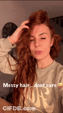 Woman With Messy Hair In Grey Nike Shirt GIF