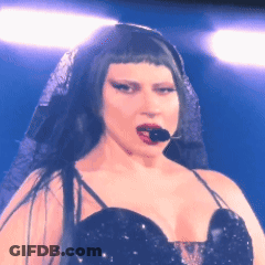 Woman With Microphone In Mouth Black Dress Veil GIF