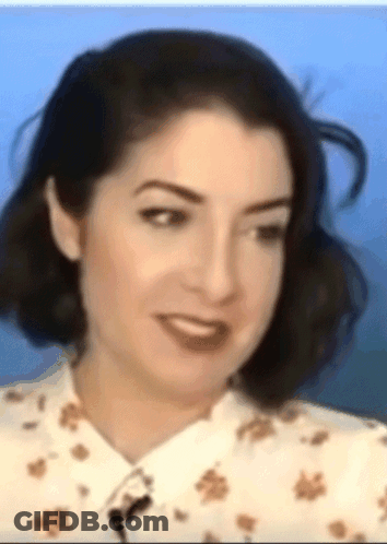 Woman With Microphone In Neck GIF