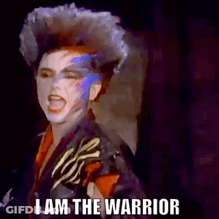 Woman With Mohawk And Painted Face Screaming GIF
