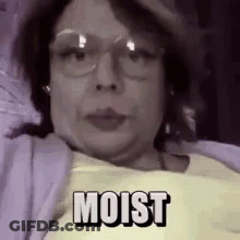 Woman With Moist On Face In Hat And Glasses GIF
