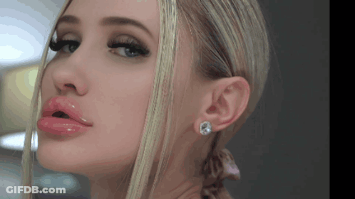 Woman With Mouth Open And Earrings Close Up GIF
