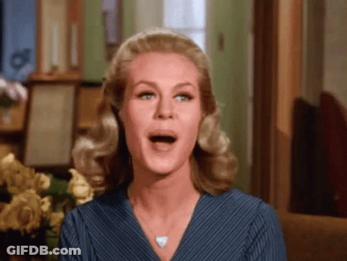 Woman With Mouth Open And Flowers GIF