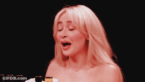 Woman With Mouth Open In Front Of Beer Bottle GIF