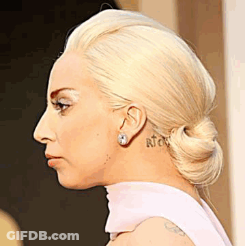 Woman With Neck And Ear Tattoo Close Up GIF