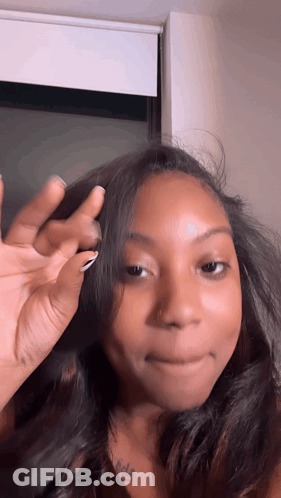 Woman With Neck Tattoo Covering Face GIF