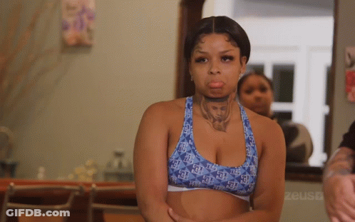 Woman With Neck Tattoo In Blue Sports Bra GIF