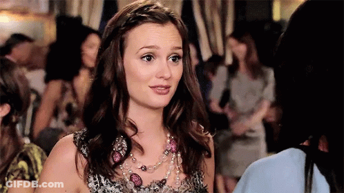 Woman With Necklace And Braided Hair In Crowd GIF