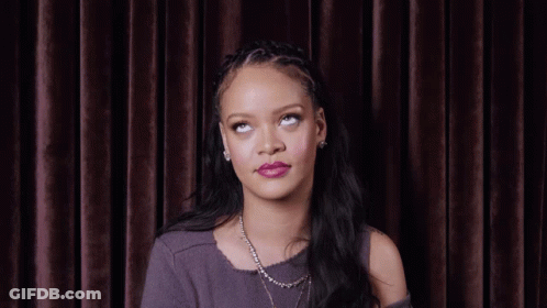 Woman With Necklace And Braided Headband Looking Up GIF
