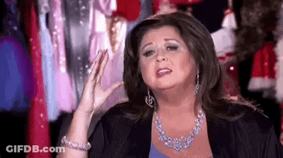 Woman With Necklace And Earrings Making Funny Face GIF