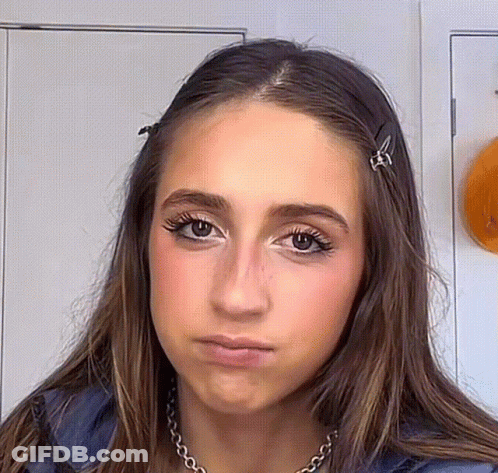 Woman With Necklace And Hair Clips GIF