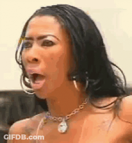 Woman With Necklace And Hoop Earrings Making Funny Face GIF