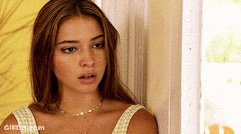Woman With Necklace Beside Door GIF