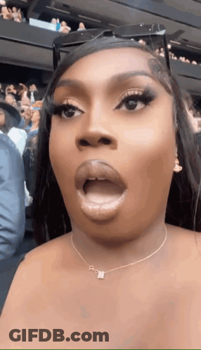 Woman With Necklace Letter N Making Funny Face GIF