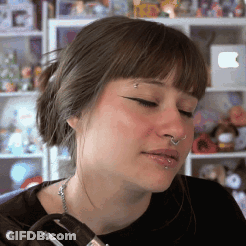 Woman With Nose Ring And Ponytail GIF