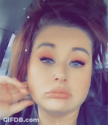 Woman With Nose Ring Making Funny Face In Back Seat GIF
