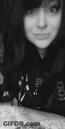 Woman With Nose Ring Smiling In Reebok Shirt GIF