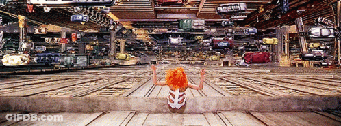 Woman With Orange Hair Next To Ambulance Sign GIF