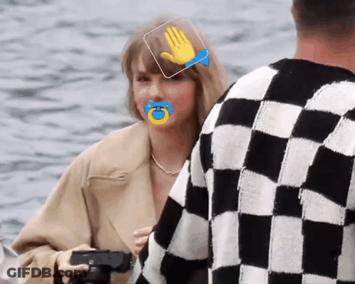 Woman With Pacifier Beside Man In Checkered Sweater GIF