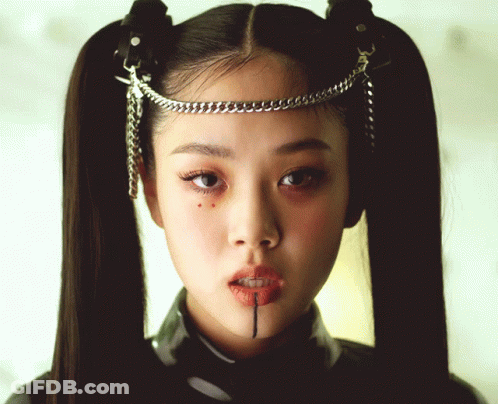 Woman With Pigtails And Chain Around Head GIF