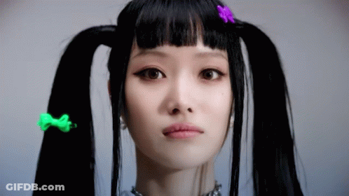 Woman With Pigtails And Colorful Hair Clips GIF
