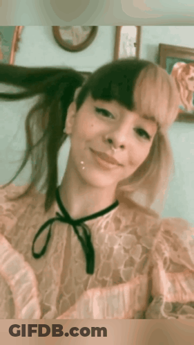 Woman With Pigtails And Nose Ring Smiling GIF