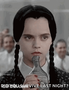 Woman With Pigtails Drinking Asking If She Survived Last Night GIF