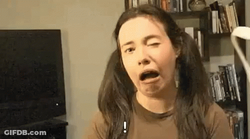 Woman With Pigtails Making Funny Face GIF