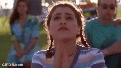 Woman With Pigtails Making Funny Face GIF