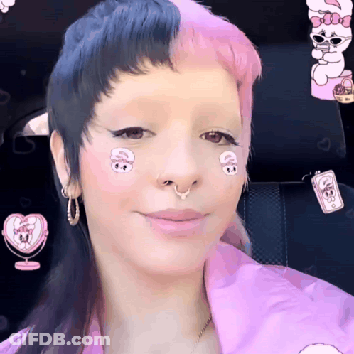 Woman With Pink And Black Hair And Nose Ring Smiling GIF