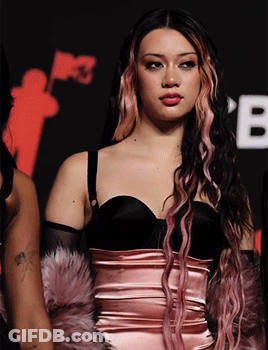 Woman With Pink And Black Hair In Black Top GIF