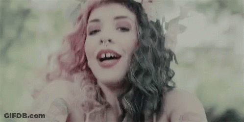 Woman With Pink And Black Hair Smiling And Flower Crown GIF