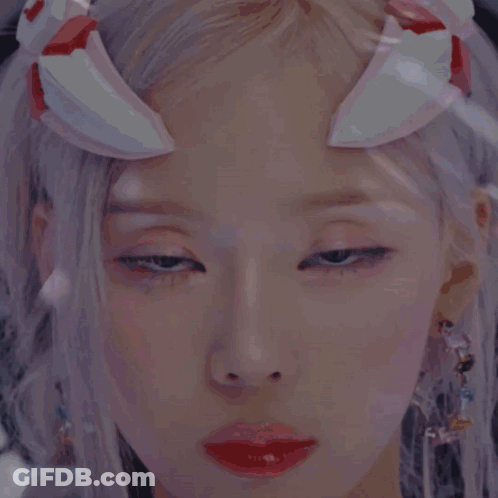Woman With Pink And White Headpiece GIF